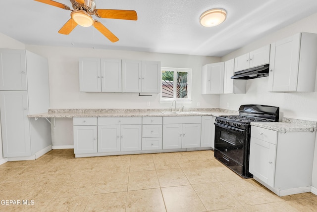 729 Delhi Dr, Socorro, TX 79927 - kitchen featuring black gas range oven, a sink, under cabinet range hood, light countertops, and white cabinets