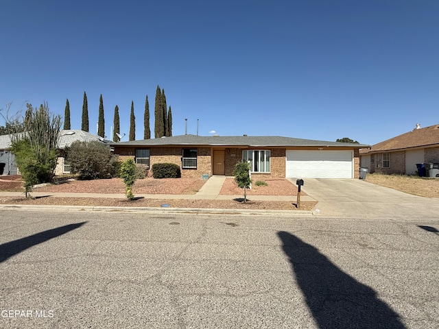 3224 Seabrook St, El Paso, TX 79936 - single story home with an attached garage, concrete driveway, and brick siding