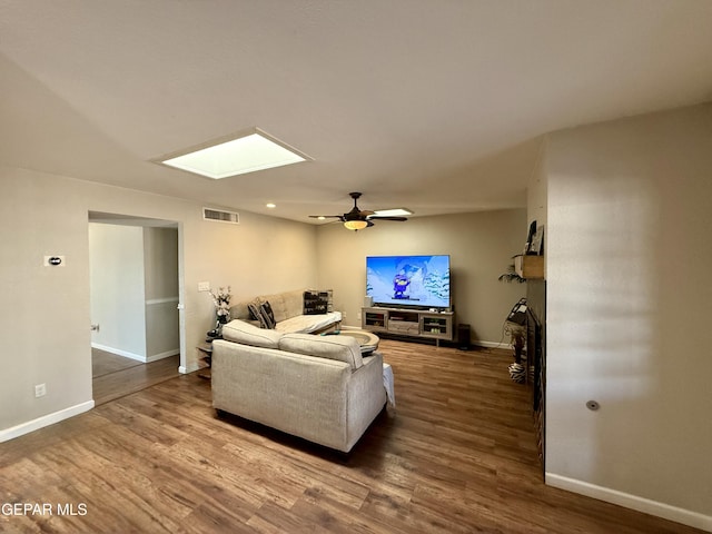 3224 Seabrook St, El Paso, TX 79936 - living area featuring wood finished floors, baseboards, and a ceiling fan