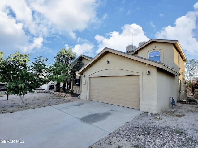 549 Northwyck Way, El Paso, TX 79928 - view of property exterior with stucco siding, a garage, and concrete driveway