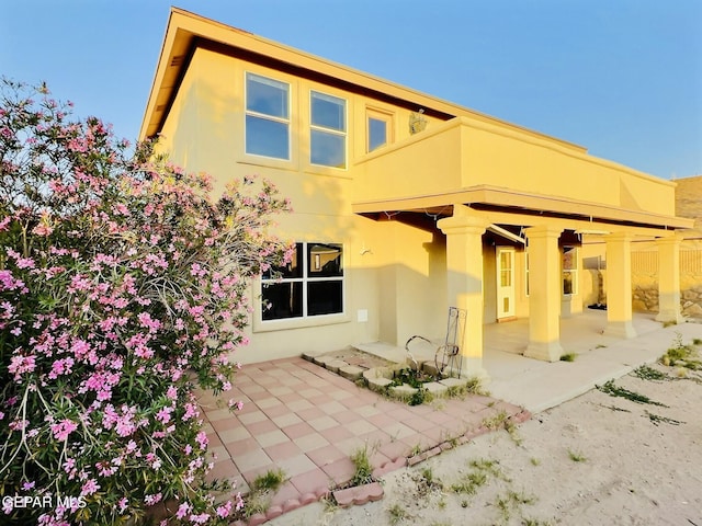 549 Northwyck Way, El Paso, TX 79928 - rear view of house featuring stucco siding and a patio area