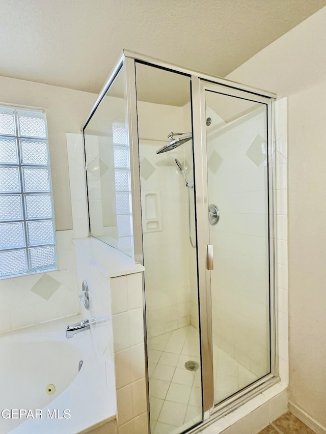 549 Northwyck Way, El Paso, TX 79928 - bathroom with a shower stall, a whirlpool tub, and tile patterned floors