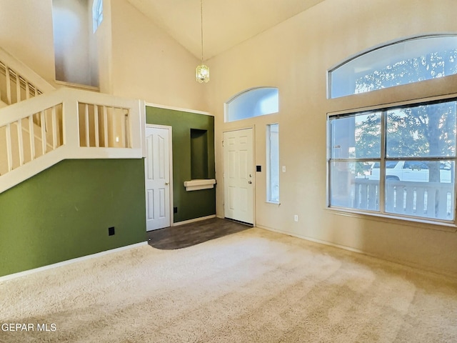 549 Northwyck Way, El Paso, TX 79928 - carpeted entryway featuring high vaulted ceiling, plenty of natural light, baseboards, and stairs