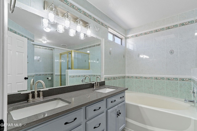 1461 Luz De Luna Pl, El Paso, TX 79912 - bathroom featuring tile walls, a bath, a stall shower, and double vanity