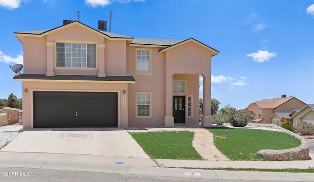 1461 Luz De Luna Pl, El Paso, TX 79912 - view of front of property featuring stucco siding, a garage, a front yard, and driveway