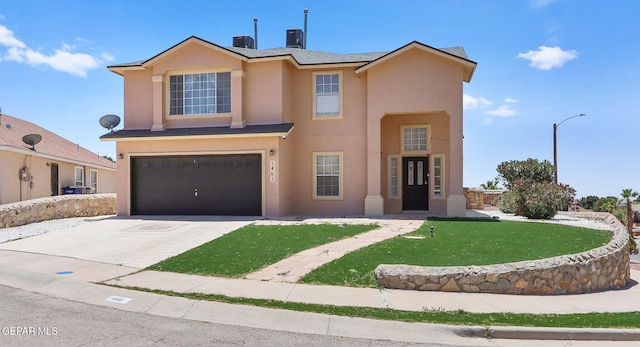1461 Luz De Luna Pl, El Paso, TX 79912 - view of front facade with stucco siding, a garage, driveway, and a front yard