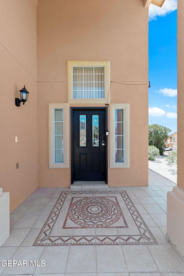 1461 Luz De Luna Pl, El Paso, TX 79912 - view of exterior entry with stucco siding and french doors