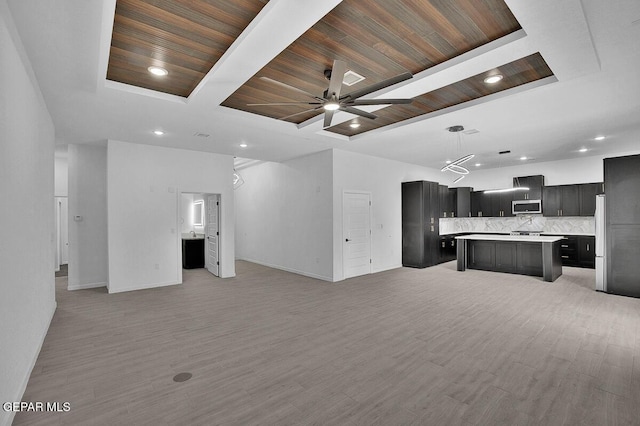 12036 Cotton Cloud Way, Socorro, TX 79927 - unfurnished living room with ceiling fan, baseboards, light wood-style flooring, wood ceiling with exposed beams, and recessed lighting