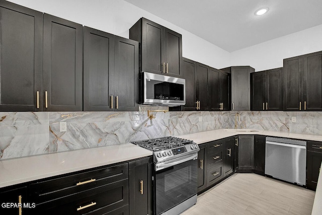 12036 Cotton Cloud Way, Socorro, TX 79927 - kitchen with stainless steel appliances, a sink, tasteful backsplash, and light countertops