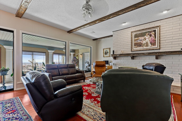 1428 Camino Alto Rd, El Paso, TX 79902 - living room featuring a textured ceiling, wood finished floors, and ceiling fan