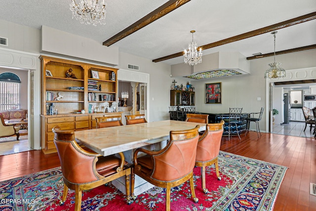 1428 Camino Alto Rd, El Paso, TX 79902 - dining space with a chandelier, beam ceiling, wood-type flooring, and a textured ceiling