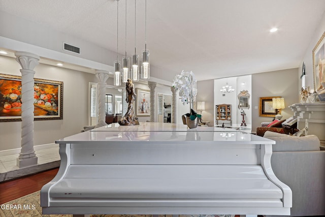 1428 Camino Alto Rd, El Paso, TX 79902 - kitchen with open floor plan, dark wood finished floors, pendant lighting, a large island, and baseboards