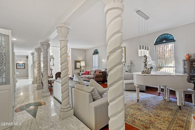 1428 Camino Alto Rd, El Paso, TX 79902 - living area with decorative columns and marble tiled flooring