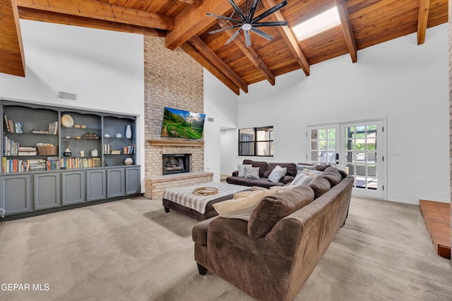 724 Gary Ln, El Paso, TX 79922 - living area with light carpet, high vaulted ceiling, a ceiling fan, wooden ceiling with exposed beams, and a fireplace
