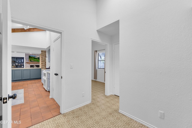 724 Gary Ln, El Paso, TX 79922 - corridor featuring baseboards and a high ceiling