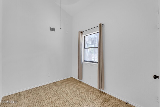 724 Gary Ln, El Paso, TX 79922 - spare room with lofted ceiling and baseboards