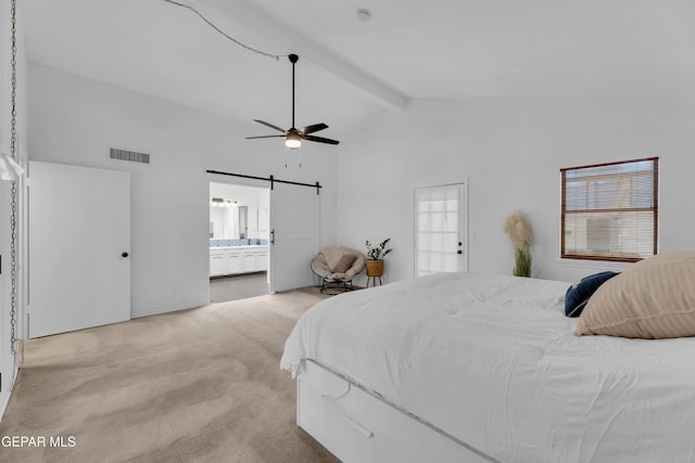 724 Gary Ln, El Paso, TX 79922 - bedroom featuring light carpet, a barn door, beam ceiling, multiple windows, and ensuite bath