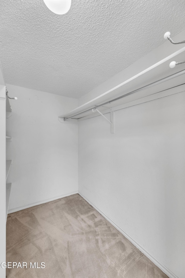 724 Gary Ln, El Paso, TX 79922 - spacious closet featuring carpet flooring