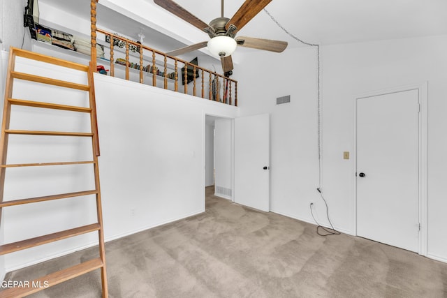 724 Gary Ln, El Paso, TX 79922 - stairs featuring a ceiling fan, carpet flooring, and a towering ceiling