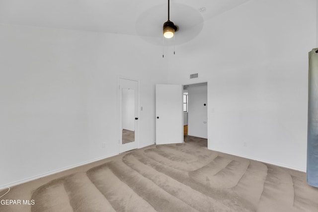 724 Gary Ln, El Paso, TX 79922 - carpeted spare room with a ceiling fan, baseboards, and a high ceiling