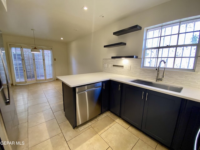 350 Thunderbird Dr Unit F45, El Paso, TX 79912 - kitchen featuring stainless steel dishwasher, a sink, open shelves, tasteful backsplash, and light countertops