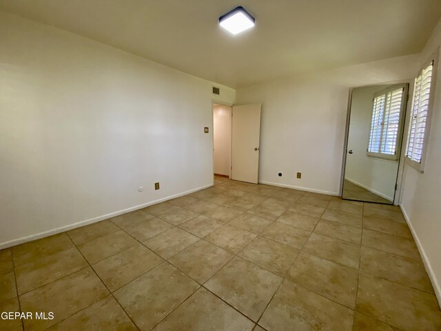 350 Thunderbird Dr Unit F45, El Paso, TX 79912 - unfurnished room with tile patterned floors and baseboards