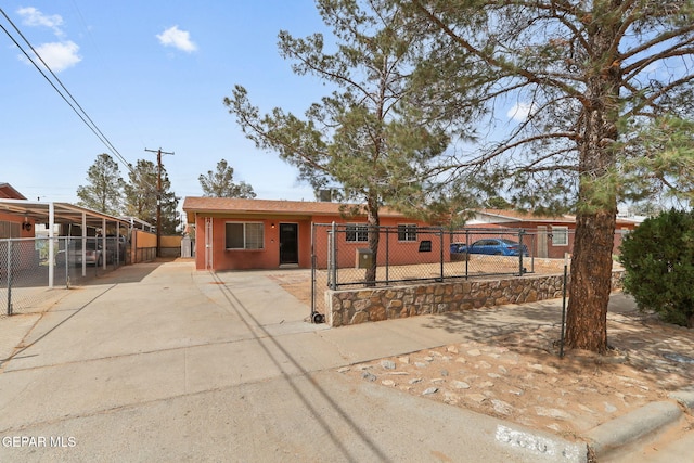 5609 Paradise Ln, El Paso, TX 79924 - view of front facade featuring concrete driveway and a gate