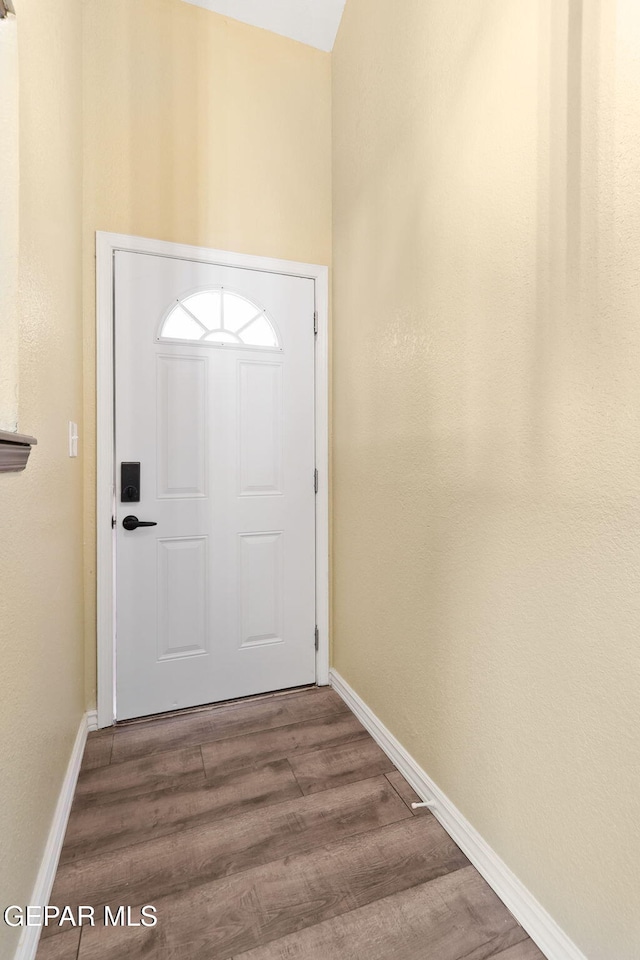 5261 Roger Maris Dr, El Paso, TX 79934 - doorway featuring wood finished floors and baseboards