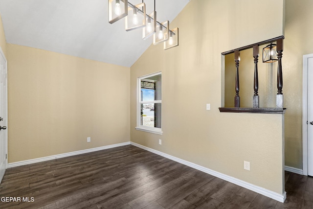 5261 Roger Maris Dr, El Paso, TX 79934 - unfurnished dining area with dark wood-style flooring, baseboards, and high vaulted ceiling