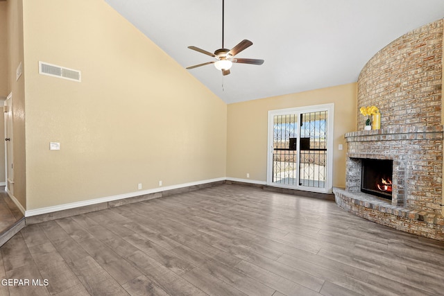 5261 Roger Maris Dr, El Paso, TX 79934 - unfurnished living room with high vaulted ceiling, a ceiling fan, wood finished floors, a fireplace, and baseboards