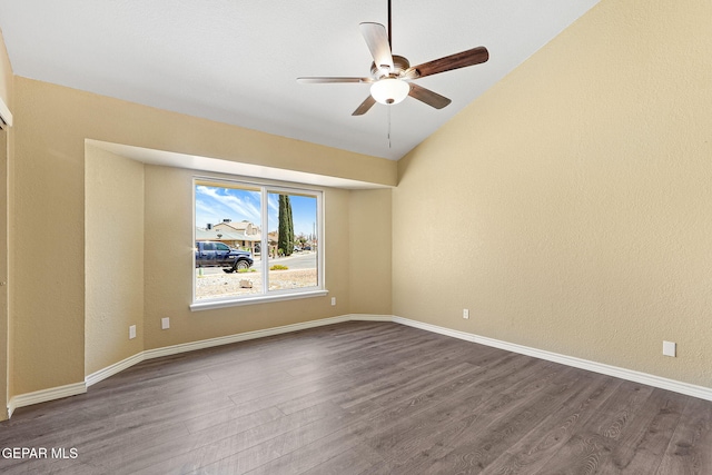 5261 Roger Maris Dr, El Paso, TX 79934 - empty room featuring dark wood-type flooring, a ceiling fan, lofted ceiling, and baseboards