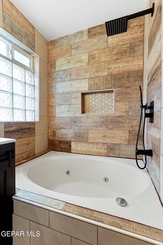 5261 Roger Maris Dr, El Paso, TX 79934 - full bathroom featuring a tub with jets, vanity, and wooden walls