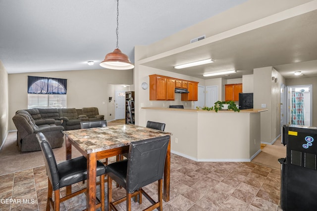 7009 Falling Leaf Cir, El Paso, TX 79934 - dining room featuring baseboards, lofted ceiling, and light stone finish floors