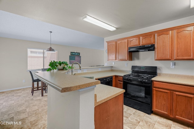 7009 Falling Leaf Cir, El Paso, TX 79934 - kitchen with black appliances, under cabinet range hood, a sink, light countertops, and a peninsula
