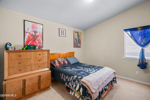 7009 Falling Leaf Cir, El Paso, TX 79934 - bedroom featuring light colored carpet, a textured ceiling, lofted ceiling, and baseboards