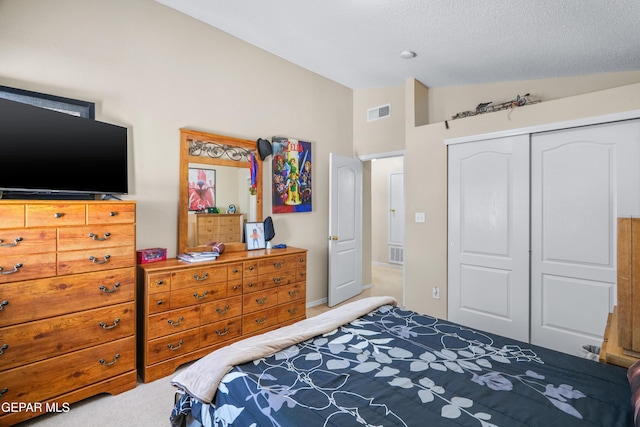 7009 Falling Leaf Cir, El Paso, TX 79934 - bedroom with lofted ceiling, carpet flooring, a closet, and a textured ceiling
