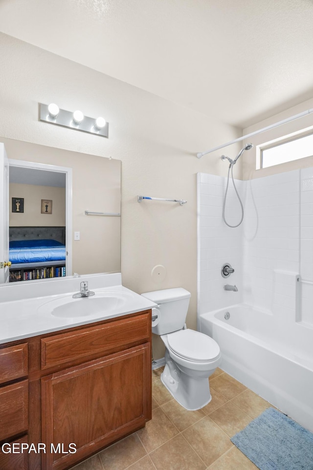 7009 Falling Leaf Cir, El Paso, TX 79934 - full bath with bathtub / shower combination, vanity, toilet, and tile patterned floors