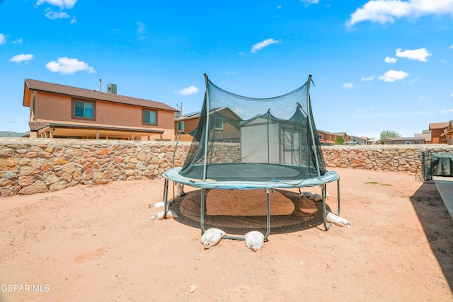 7009 Falling Leaf Cir, El Paso, TX 79934 - view of yard with a trampoline