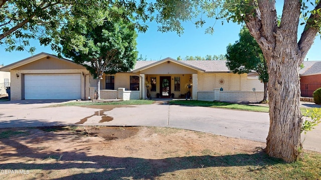 492 Country Oaks Dr, El Paso, TX 79932 - single story home with driveway, a porch, a garage, and brick siding