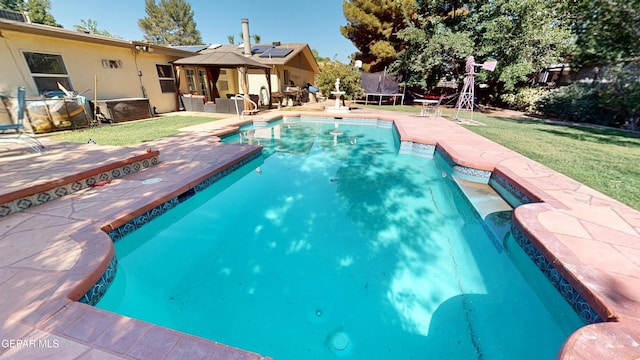 492 Country Oaks Dr, El Paso, TX 79932 - outdoor pool with a gazebo, a trampoline, a patio, and a lawn