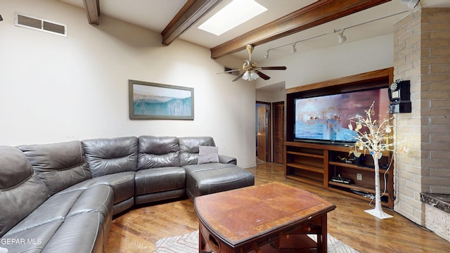 492 Country Oaks Dr, El Paso, TX 79932 - living room featuring beamed ceiling, a ceiling fan, track lighting, and wood finished floors