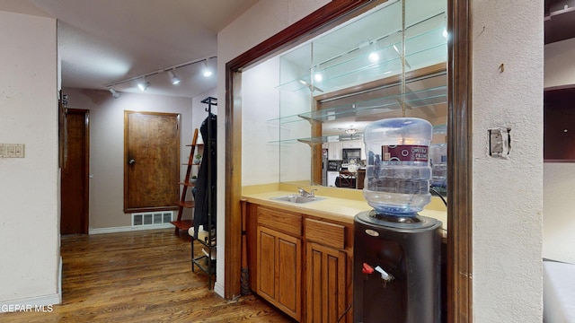 492 Country Oaks Dr, El Paso, TX 79932 - bar area featuring track lighting, wood finished floors, a sink, and baseboards