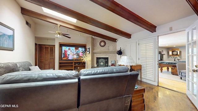 492 Country Oaks Dr, El Paso, TX 79932 - living area featuring wood finished floors, a fireplace, and ceiling fan