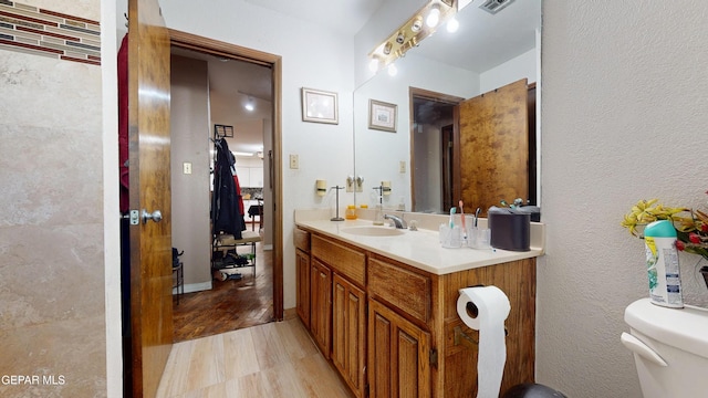 492 Country Oaks Dr, El Paso, TX 79932 - bathroom with vanity, toilet, and wood finished floors
