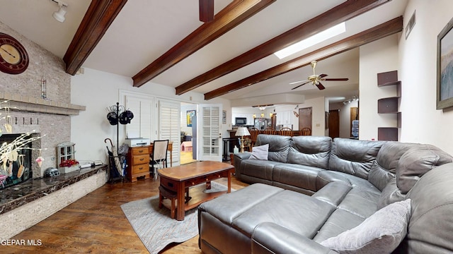 492 Country Oaks Dr, El Paso, TX 79932 - living room with a brick fireplace, wood finished floors, and ceiling fan