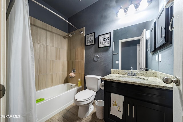12805 Epsom Dr, Horizon City, TX 79928 - full bathroom featuring shower / bath combo, a textured wall, toilet, vanity, and wood finished floors