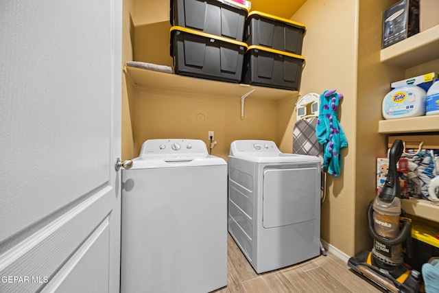12805 Epsom Dr, Horizon City, TX 79928 - laundry area featuring washer and dryer, light wood-style floors, and baseboards