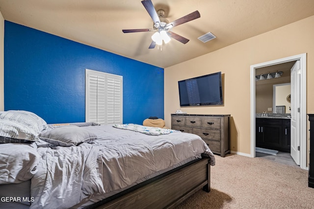 12805 Epsom Dr, Horizon City, TX 79928 - bedroom featuring light colored carpet, ceiling fan, and connected bathroom