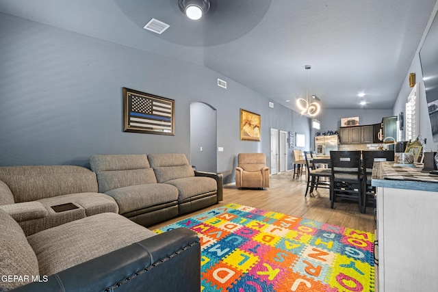 12805 Epsom Dr, Horizon City, TX 79928 - living area with light wood finished floors and arched walkways