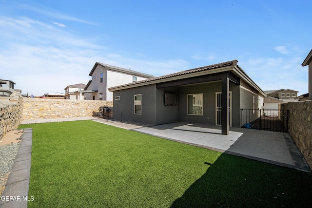 12805 Epsom Dr, Horizon City, TX 79928 - rear view of house with stucco siding, a patio area, and a tiled roof